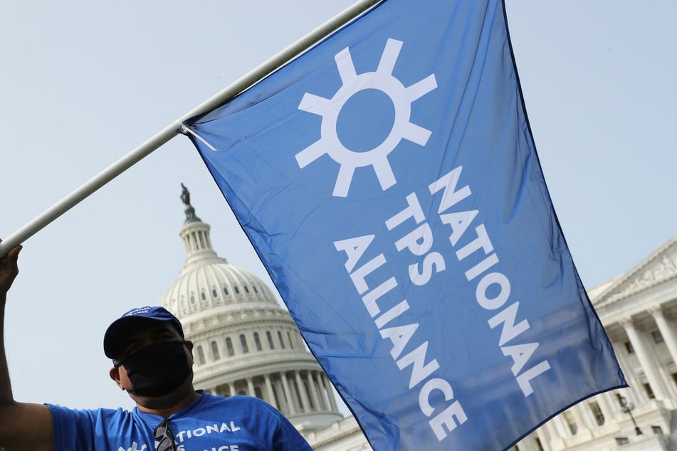 National TPS Alliance members and supporters rally for protections outside the US Capitol in Washington DC.