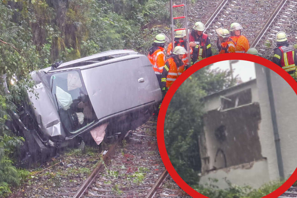 Spektakulärer Unfall: SUV-Fahrer schießt durch Garagenwand und landet auf Bahnstrecke