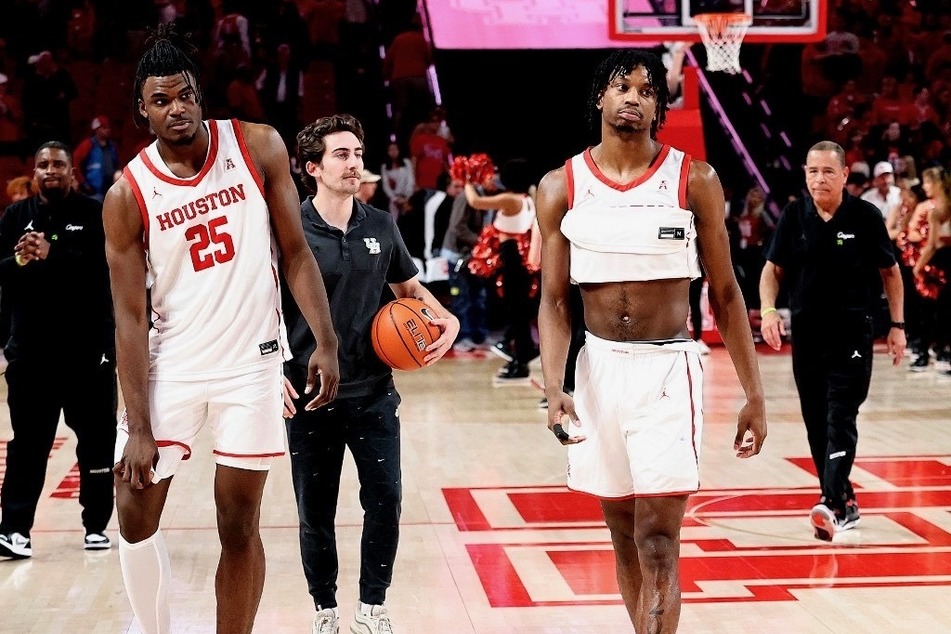 Jarace Walker (l) and Tramon Mark of the Cougars walked off the court in shock and frustration after losing to unranked Temple basketball, as Houston was the best ranked team in the nation.