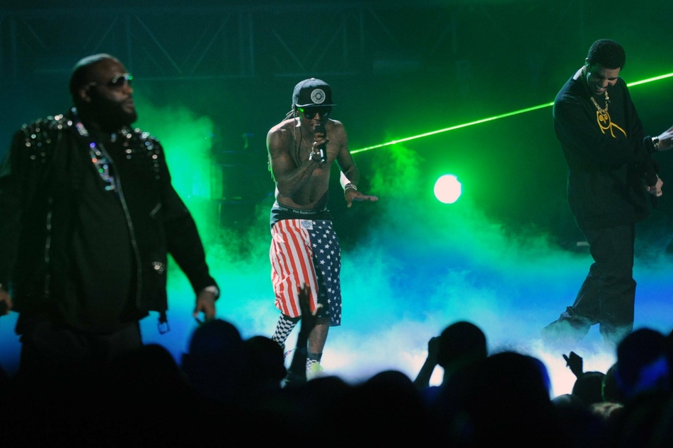 Rick Ross (l.), Lil Wayne (c.), and Drake (r.) performed together at the BET Awards in 2011.