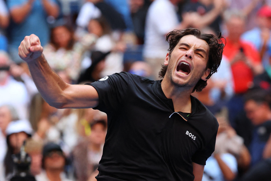 Taylor Fritz celebrates after winning his US Open quarter-final match against Germany's Alexander Zverev.