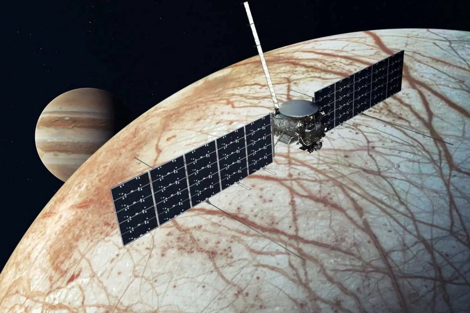 An artist's concept shows a NASA's Europa Clipper spacecraft flying past Jupiter's moon Europa in this undated illustration released by NASA.