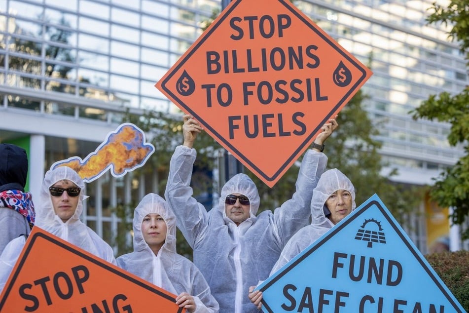 Climate activists protest against investment in fossil fuels outside the World Bank headquarters in Washington DC.