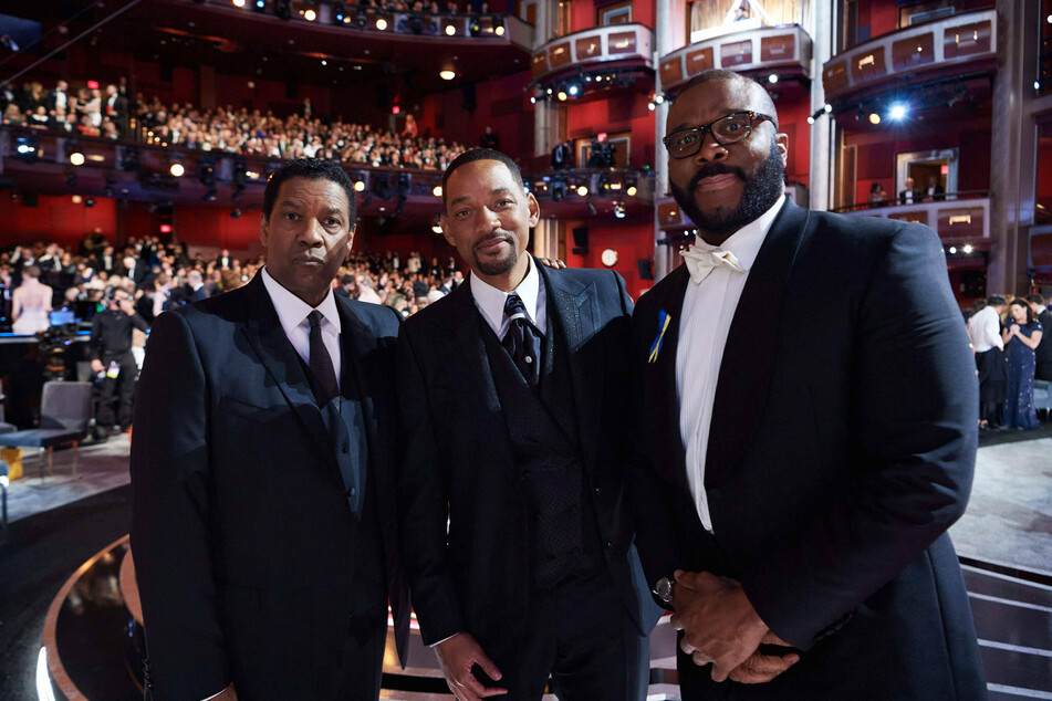 Denzel, Will, and Tyler Perry at the 94th Annual Academy Awards ceremony. Perry also comforted the King Richard star following his public assault against Rock.