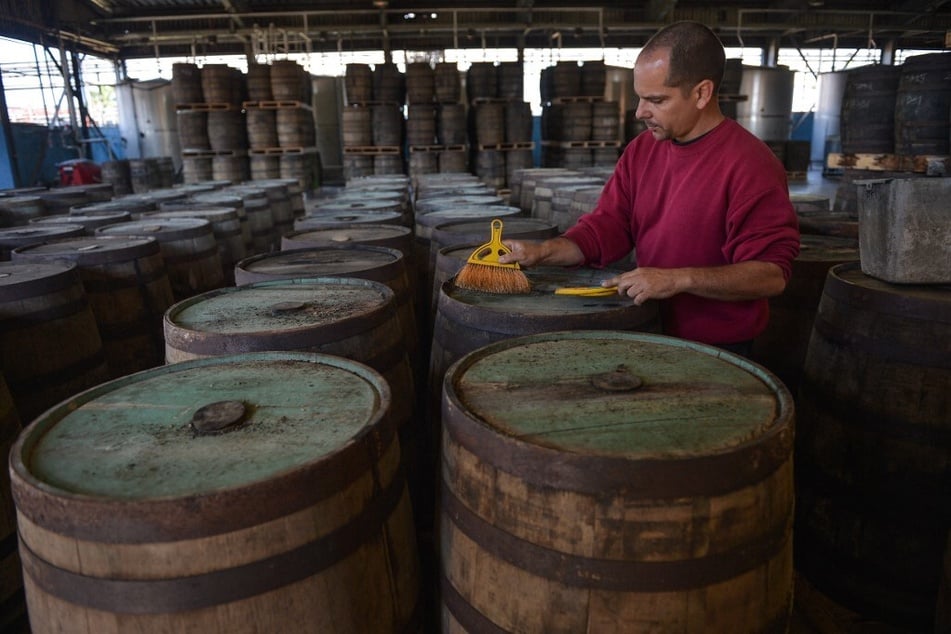 A worker cleans rum barrels at the Havana Club distillery in San Jose de las Lajas, Mayabeque province, Cuba.