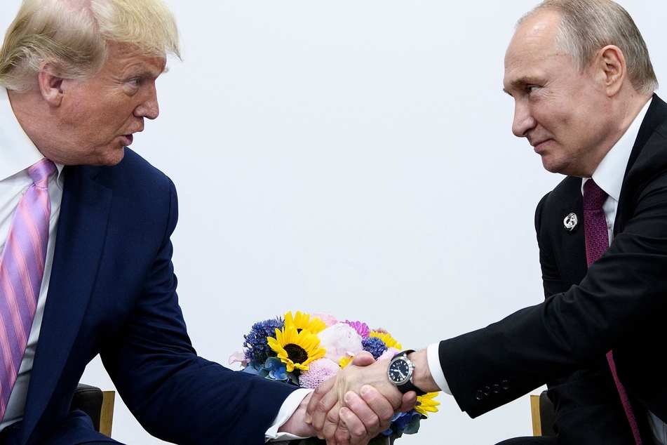 Then-President Donald Trump (l.) attends a meeting with Russia's President Vladimir Putin (r.) during the G20 summit in Osaka on June 28, 2019.