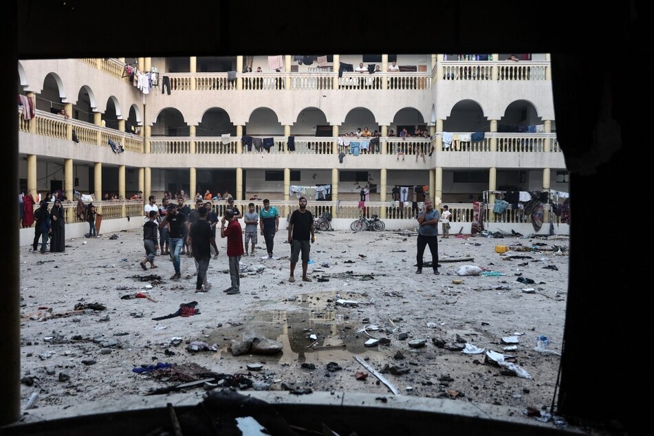 Displaced Palestinians gather in the yard of a school hit by an Israeli strike in Gaza City on August 10, 2024, that killed more than 90 people.