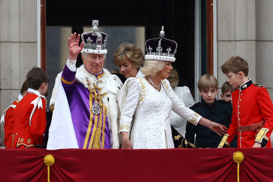 As King Charles and Queen Consort Camilla returned to Buckingham Palace, a flyover to mark the coronation has been scaled down due to "unsuitable weather conditions."