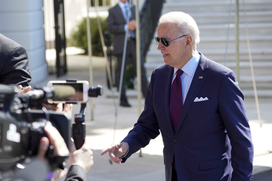 Joe Biden speaks with reporters outside the White House before his planned departure for Surfside, Florida, on Thursday.