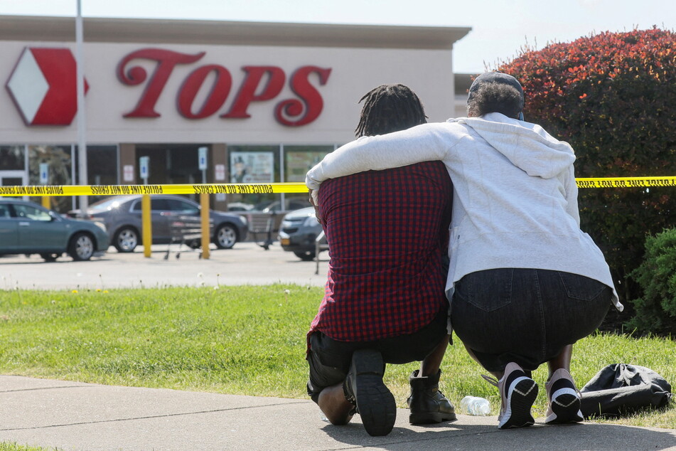 Mourners attend a vigil for victims of the terrorist attack at a Tops supermarket in Buffalo, New York.