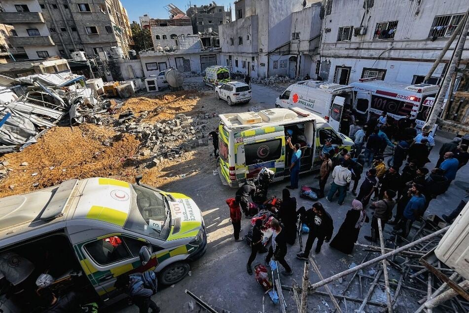 Medics evacuate injured people and cancer patients from the Kamal Adwan Hospital in Beit Lahia in the northern Gaza Strip on October 28, 2024, to al-Shifa hospital in Gaza City in a joint World Health Organization and Palestinian Red Crescent initiative.