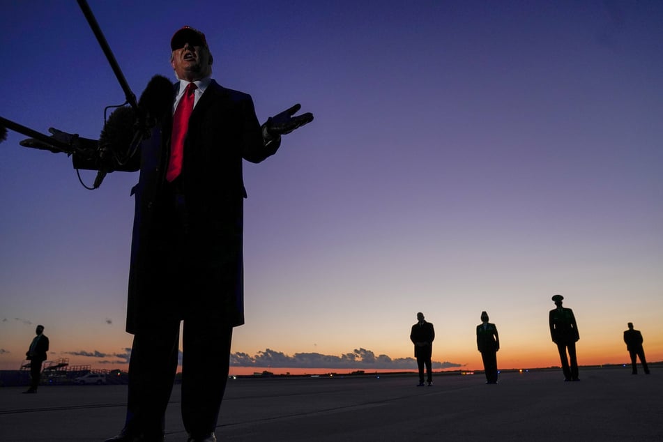 President Donald Trump speaks to reporters at the Hickory Regional Airport in North Carolina.