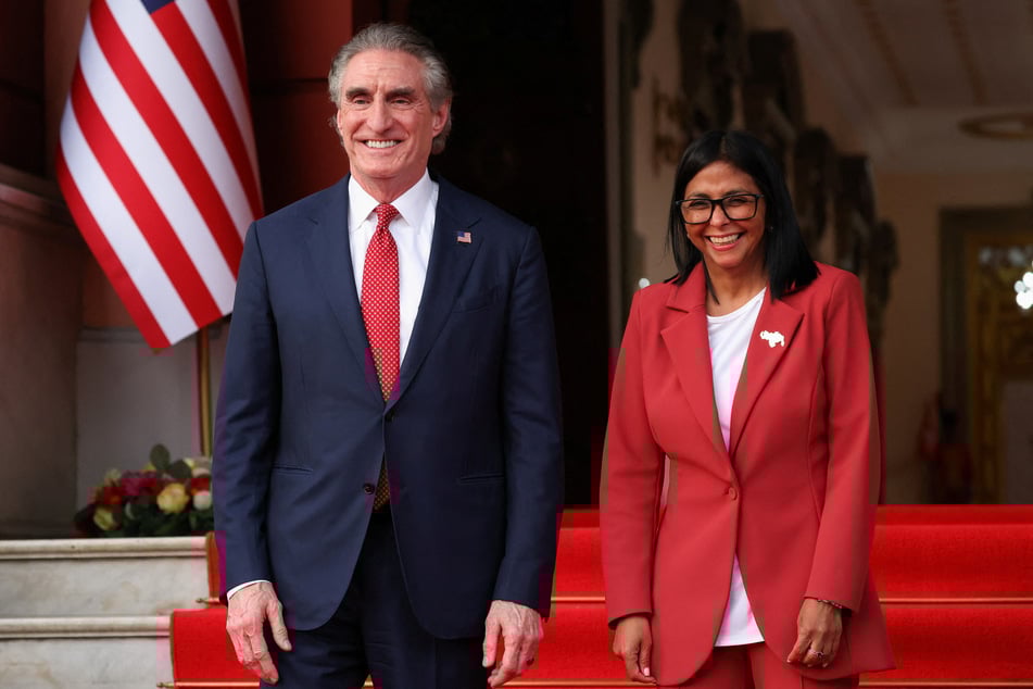 Venezuela's interim President Delcy Rodriguez (r.) and US Interior Secretary Doug Burgum stand together outside Miraflores Palace in Caracas on March 4, 2026.
