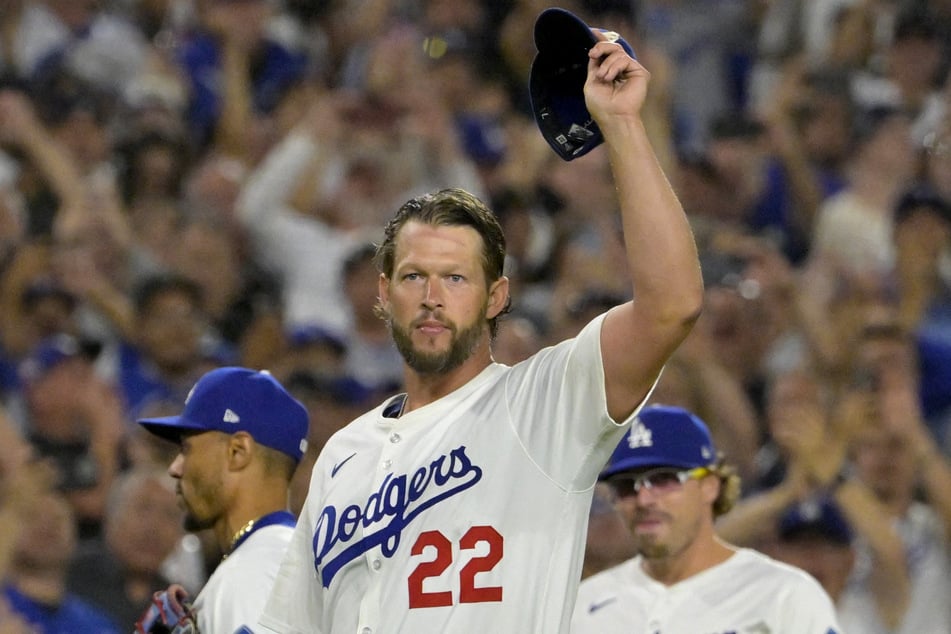 Los Angeles Dodgers starting pitcher Clayton Kershaw acknowledges the crowd after striking out Chicago White Sox third baseman Vinny Capra for his 3,000th career strike.