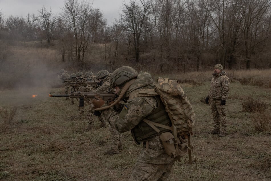 Ukrainian soldiers of the 1st Separate Assault Battalion Da Vinci take part shoot during a training exercise in the Dnipropetrovsk region, on December 12, 2024, amid the Russian invasion of Ukraine.