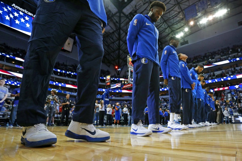 Dallas Mavericks players stand for the national anthem before a game (archive image).