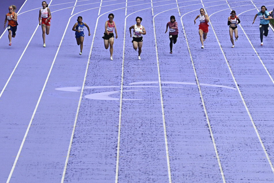 (from 3rdL) Indian Bronze medallist Preethi Paal, Silver medallist Guo Qianqian, Chinese Gold medallist Zhou Xia compete during the women's T35 100m final athletics event at the Stade de France in Saint-Denis, north of Paris on Friday, during the Paris 2024 Paralympic Games.