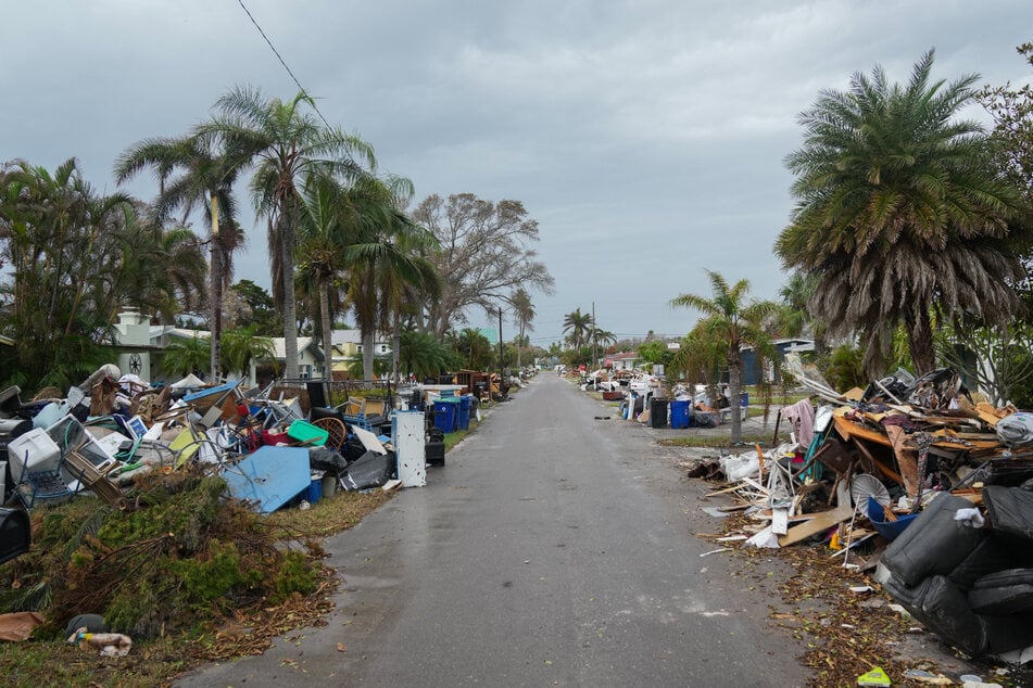 As the second huge hurricane in as many weeks rumbled toward Florida's west coast, a sense of looming catastrophe spread as people raced to board up homes and flee.