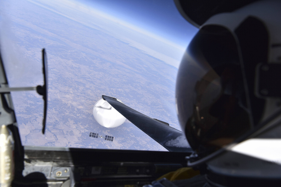 A US Air Force U-2 pilot looks down at a suspected Chinese surveillance balloon, as it hovers over the Central Continental United States on February 3, 2023.