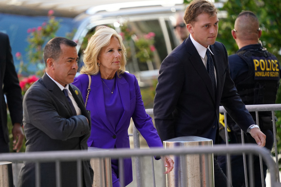 First Lady Jill Biden (c.) arrives at the federal court in Wilmington on the opening day of Hunter Biden's trial.