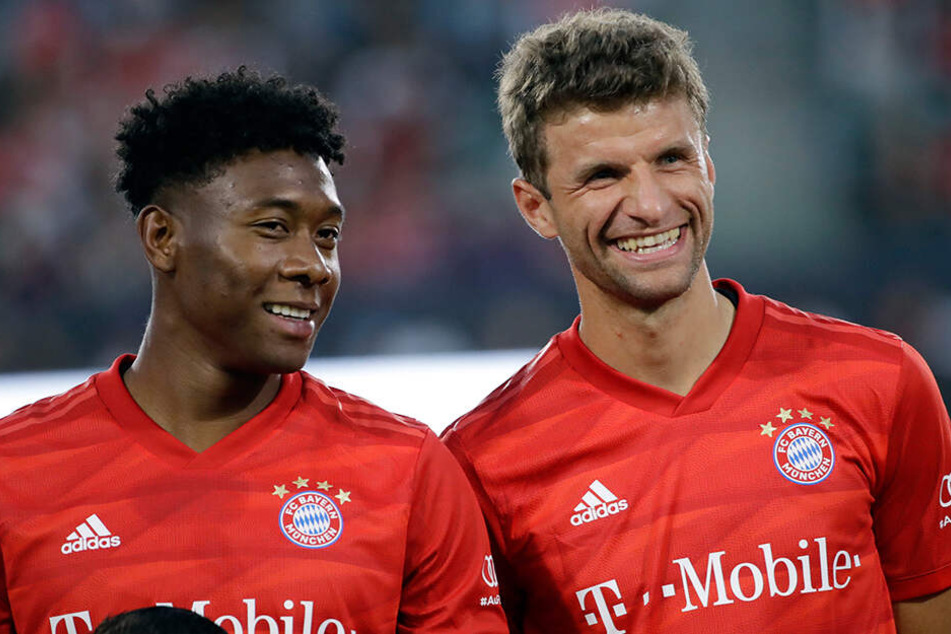 David Alaba und sein Teamkollege Thomas Müller.