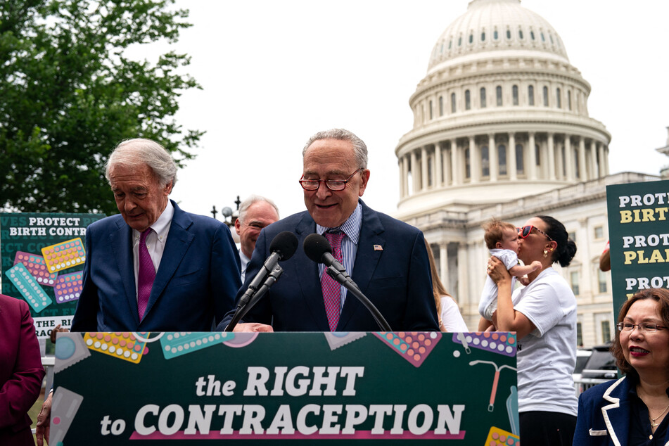 Chuck Schumer (c.) has been introducing "messaging bills" – legislation that has little chance of becoming law but plants a flag on the party's policy positions – to boost members with tight re-election races.
