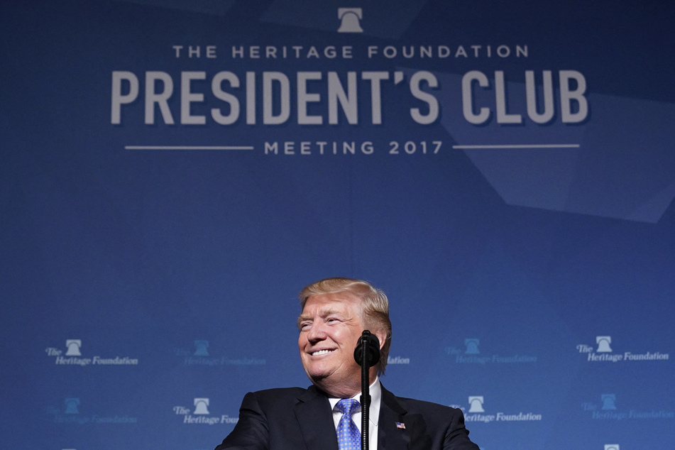 Donald Trump smiles while delivering a speech on tax reform at the Heritage Foundation's President's Club Meeting on October 17, 2017.