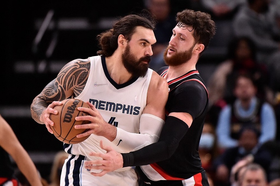 Steven Adams (l) of the Memphis Grizzlies drives against Jusuf Nurkic of the Portland Trail Blazers during the first half at FedEx Forum.