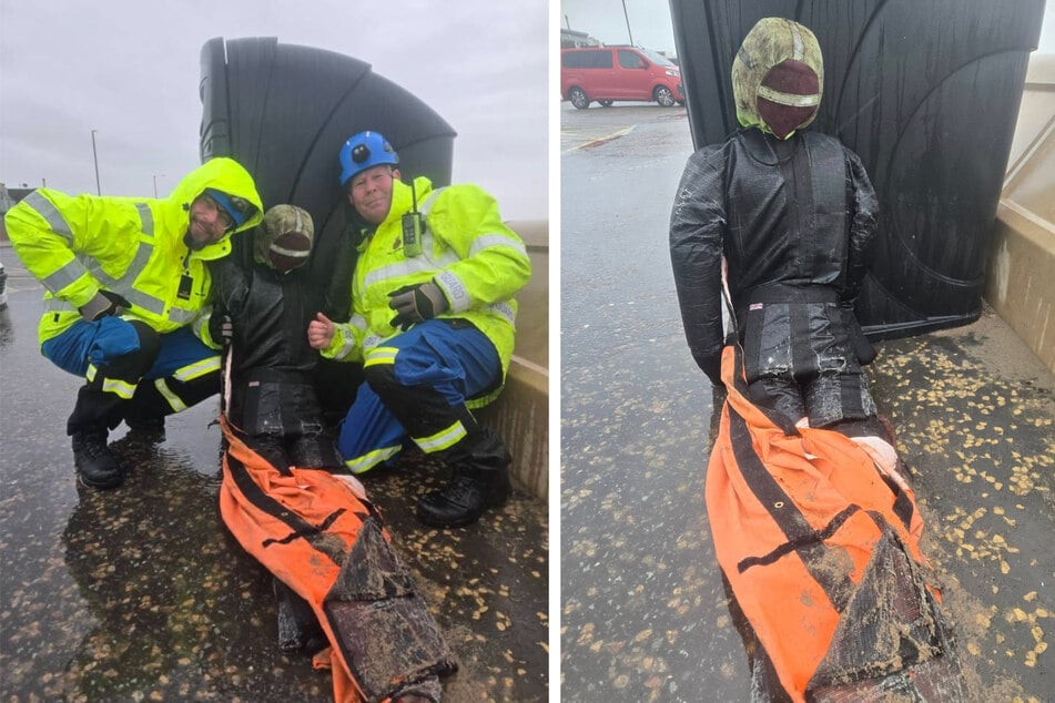 Rescue workers pose with the training object, which fortunately turned out not to be alive.