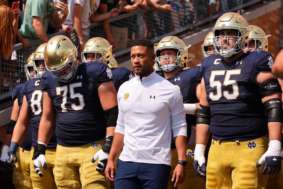 Head coach Marcus Freeman of the Notre Dame Fighting Irish prepares to take the field prior to the game against the Marshall Thundering Herd at Notre Dame Stadium.