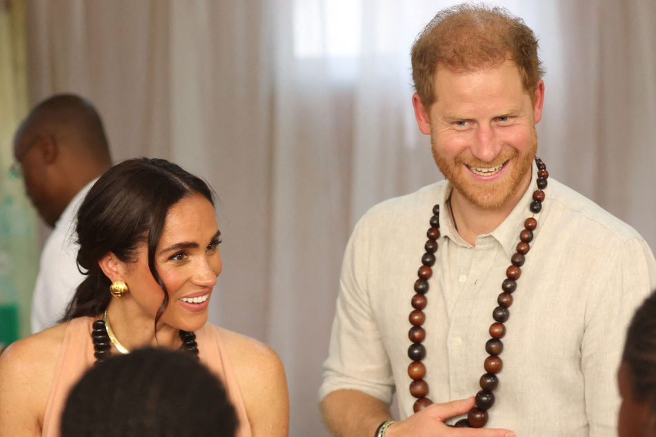 Prince Harry (r.) and Meghan Markle spent three days in Nigeria as they promoted the Invictus Games.
