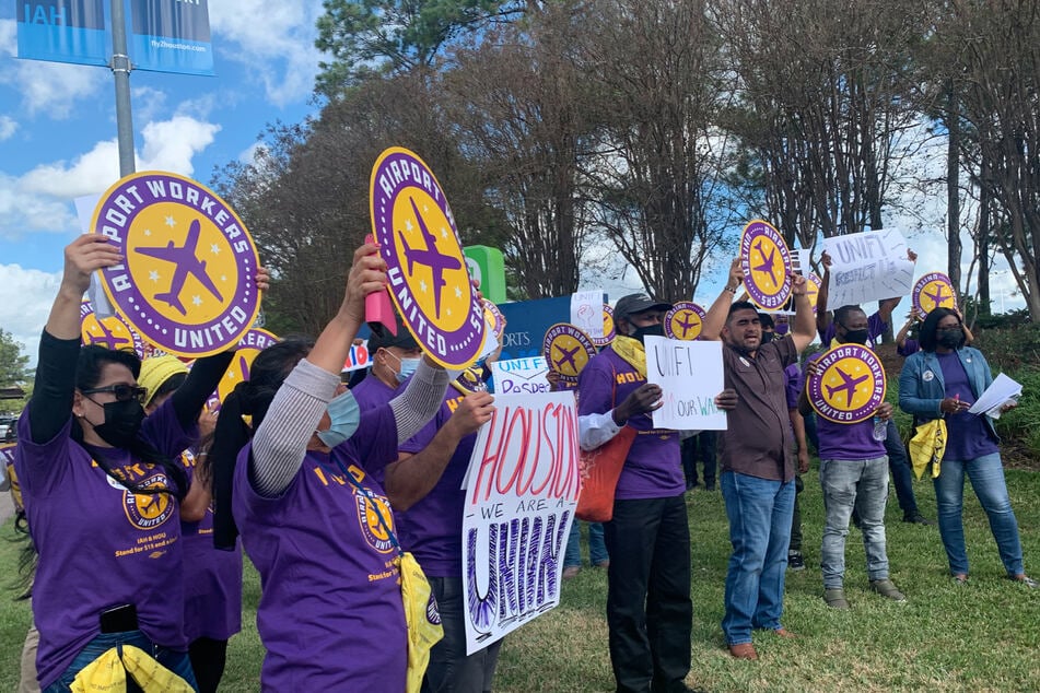 Teresa McClatchie (r.) and her colleagues rally outside IAH for $15 an hour and a union.