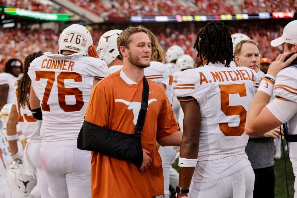 The Texas Longhorns' road to the Big 12 championships may prove to be more challenging than initially anticipated without their starter quarterback Quinn Ewers (c).