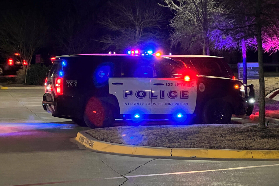 A police car blocking the road to the Congregation Beth Israel in Colleyvill, Texas, where people were held hostage by a British man.