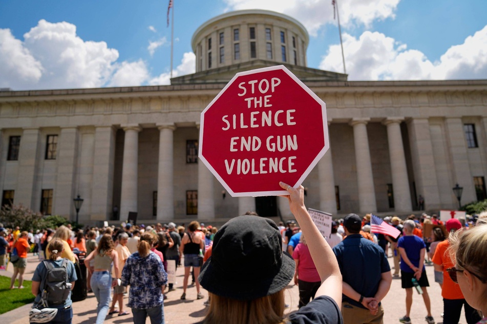 Ohioans protest for stricter firearm laws to end gun violence outside the state Capitol in Columbus.