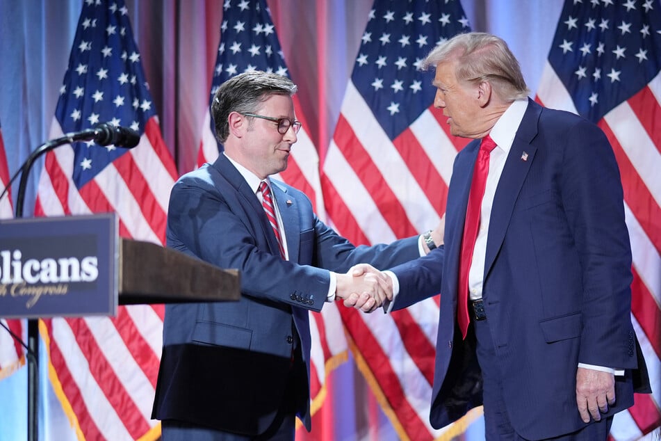 House Speaker Mike Johnson (l.) shakes hands with President-elect Donald Trump at the Hyatt Regency on Capitol Hill on November 13, 2024 in Washington, DC.