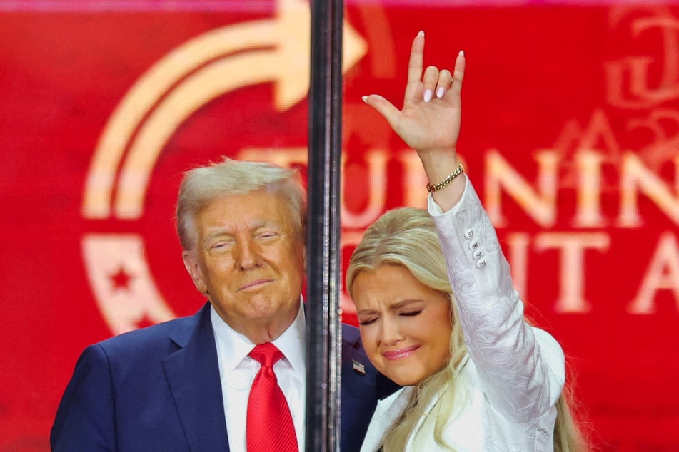 Erika Kirk (r.) gestures next to President Donald Trump during a memorial service for her husband Charlie Kirk at State Farm Stadium in Glendale, Arizona, on September 21, 2025.