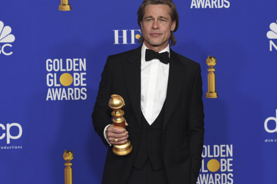 Brad Pitt freute sich mit einem kleinen Lächeln über seinen Preis.
