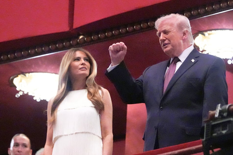 Donald and Melania Trump greeted with boos and cheers at Kennedy Center event
