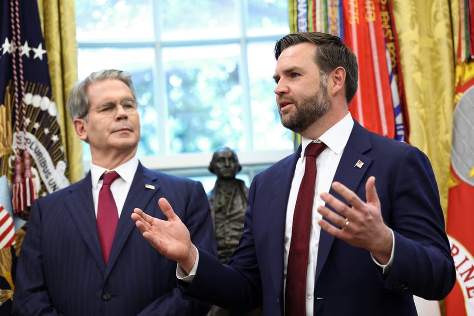 Vice President JD Vance (r.) speaks next to Treasury Secretary Scott Bessent after Donald Trump signed an executive order on a deal that would divest TikTok's US operations from ByteDance on September 25, 2025.