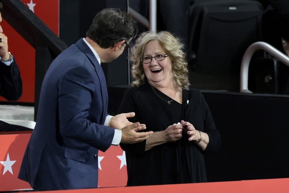 Bev Vance (r.), mother of J.D. Vance, stands with Speaker of the House Mike Johnson on the third day of the Republican National Convention.