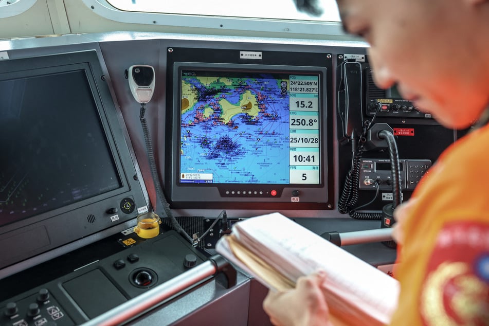 Photo by I-HWA CHENG / AFP In this photo taken on October 28, 2025, a monitor on the Taiwan Coast Guard ship PP-10081 displays the maritime conditions around Kinmen.