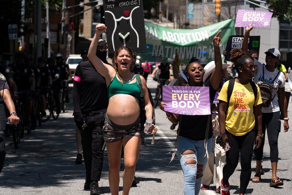 Protesters march through Downtown Atlanta in opposition to Georgia's harsh anti-abortion law.
