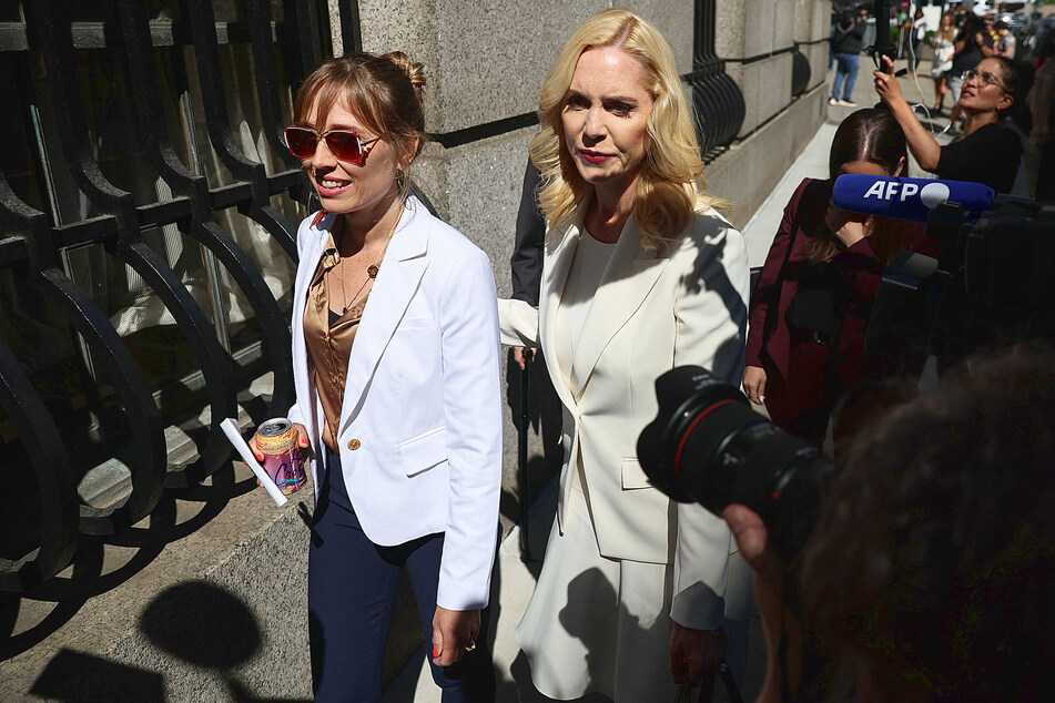 Annie Farmer (l) arrives with lawyer Sigrid McCawley for Maxwell's sentencing.