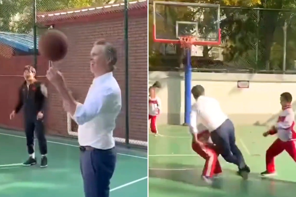 California Governor Gavin Newsom (c) accidentally ran into a child while showing off his basketball skills during his recent trip to China.