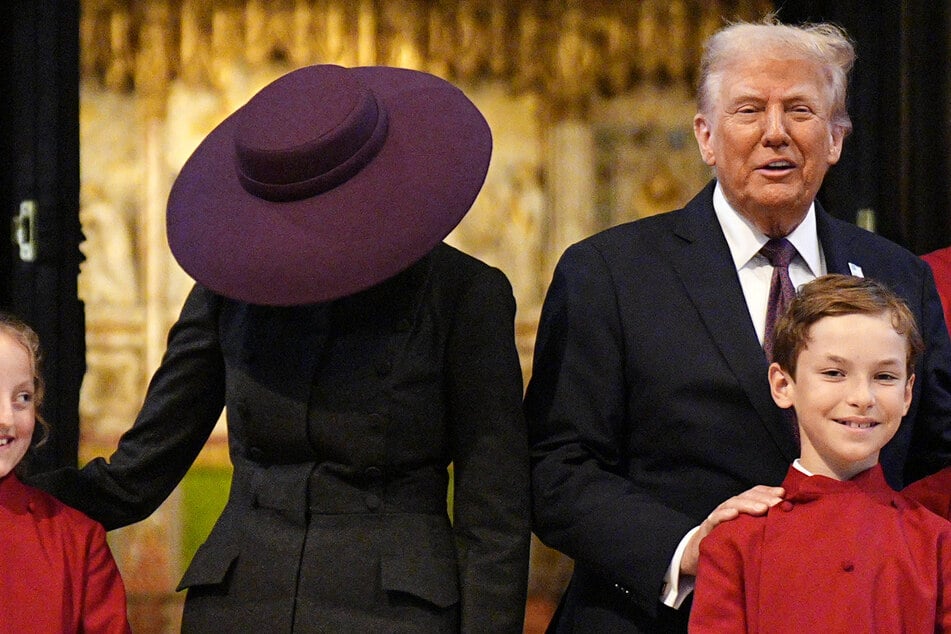 Melania Trump's massive purple hat drew comparisons to a UFO or a lampshade.