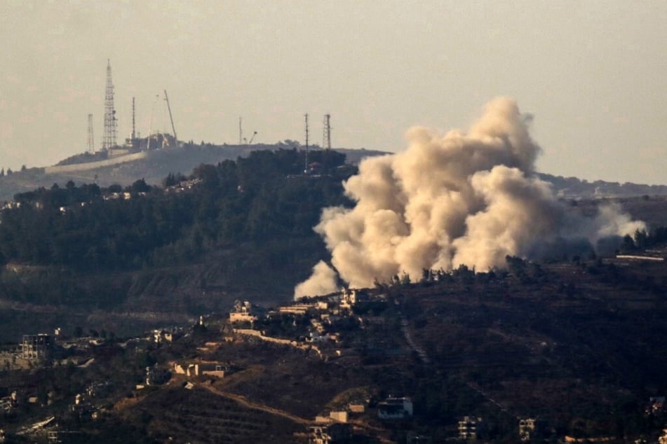 Smoke rises over the southern Lebanese village of Odaisseh during an Israeli strike on October 26, 2024.