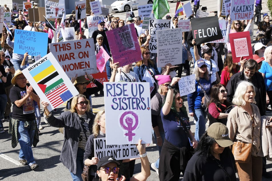 Demonstrators gather during a march on International Women's Day in Los Angeles, California on Saturday.