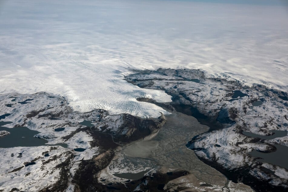 The Earth's ice sheets, like those in Greenland (pictured), may continue melting even if the planet's temperature does not increase any further, the report warns.