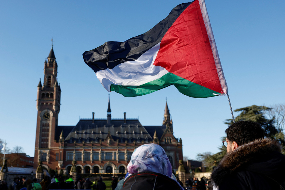 Supporters of Palestinian freedom rally outside the International Court of Justice in The Hague, Netherlands, in support of South Africa's genocide case against Israel.